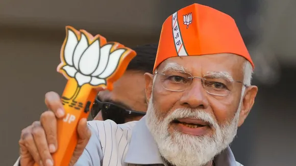 Prime Minister Narendra Modi during a roadshow ahead of the upcoming Lok Sabha election, in Ghaziabad, Saturday, April 6, 2024