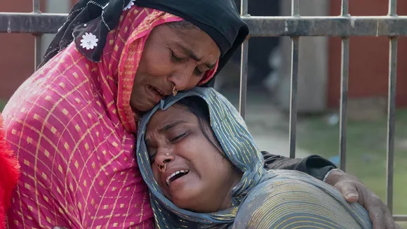 Relatives react after the arrest of people for their alleged involvement in child marriages, during Assam government's statewide crackdown on child marriages, outside Mayong police station in Morigaon district