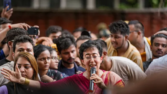 Delhi minister Atishi speaks with students protesting over the death of three civil services aspirants due to drowning at a coaching centre in Old Rajinder Nagar area, in New Delhi, Wednesday, July 31, 2024.