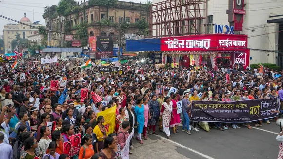Members of Bengal Junior Doctors' Front and others take part in a mega rally on 'Mahalaya' to demand justice for the alleged sexual assault and murder of a trainee doctor at RG Kar Medical College and Hospital, in Kolkata, Wednesday, Oct 2, 2024.