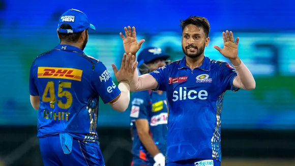 Mumbai Indians bowler Akash Madhwal celebrates with teammate Rohit Sharma the wicket of Lucknow Super Giants batter Ravi Bishnoi at M A Chidambaram Stadium on May 24
