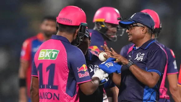 Rajasthan Royals batter Sanju Samson talks with umpires during the Indian Premier League (IPL) 2024 cricket match between Delhi Capitals and Rajasthan Royals, at Arun Jaitley Stadium, in New Delhi, Tuesday, May 7, 2024.