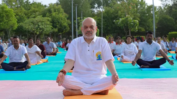 Union Home Minister Amit Shah performs yoga with others at Gotila Garden on the 10th International Day of Yoga, in Ahmedabad