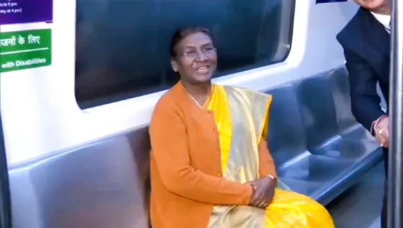 President Droupadi Murmu rides in a metro train in New Delhi