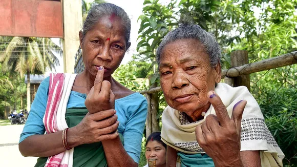 Elderly Bodo tribal women show their ink-marked finger after casting their vote during voting for the 2nd phase of Lok Sabha elections, at Tupilia village in Baksa district, Friday, April 26, 2024
