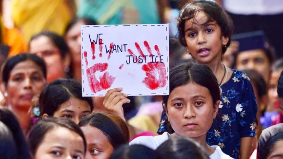 Locals protest against an alleged gang-rape of a 14-year-old girl by three men at Dhing area, in Nagaon district, Friday, Aug. 23, 2024.