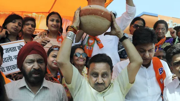 BJP MP Praveen Khandelwal with party workers during a protest against Delhi Government over the ongoing water crisis, at Model Town in Delhi, Monday, June 17, 2024.