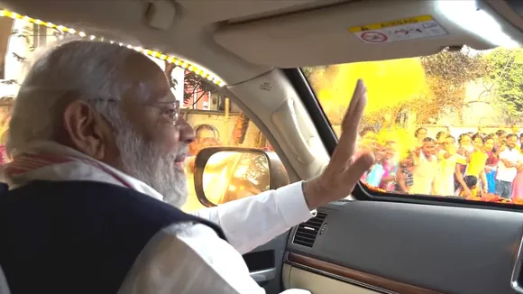 People in Guwahati welcomed PM Modi with Gulal on Tuesday during a roadshow