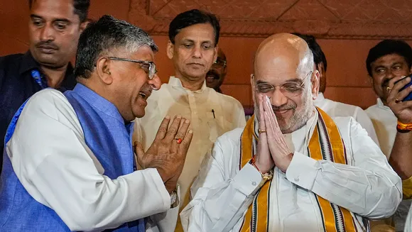 Union Home Minister Amit Shah and BJP MP Ravi Shankar Prasad at Parliament House after the Women's Reservation Bill was passed in Lok Sabha during the Special session, in New Delhi, Wednesday, Sept. 20, 2023.