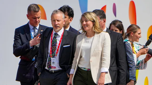 Canadian Foreign Minister Melanie Joly with others during the G20 Foreign Ministers' Meeting at RBCC in New Delhi on Thursday