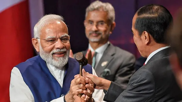 President of Indonesia Joko Widodo symbolically hands over the G20 Presidency to Prime Minister Narendra Modi in Bali