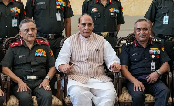 Defence Minister Rajnath Singh flanked by Chief of Army Staff General Manoj Pande, right, and Chief of Defence Staff of the Indian Armed Forces Anil Chauhan at the 75th anniversary event of ‘UN Peacekeepers Day’, in New Delhi