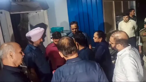 ED officials at the residence of Delhi Chief Minister Arvind Kejriwal after the high court refused to grant him protection from coercive action in an excise policy-linked money laundering case, in New Delhi, Thursday, March 21, 2024.