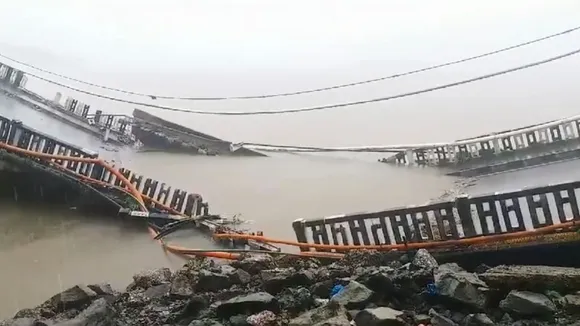 The bridge across the Kali River collapses near Karwar in Uttara Kannada district, Wednesday, Aug. 7, 2024.