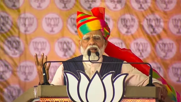 Prime Minister Narendra Modi addresses a public meeting ahead of Lok Sabha elections, in Barmer district, Rajasthan, Friday, April 12, 2024