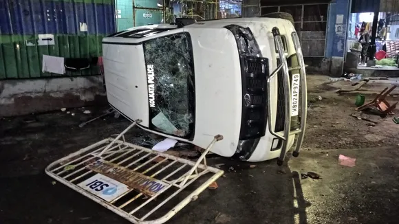 A vandalised Kolkata Police vehicle is seen amid protest at the RG Kar Medical College and Hospital against the alleged rape and murder of a trainee doctor inside the hospital premises, in Kolkata, early Thursday, Aug. 15, 2024.
