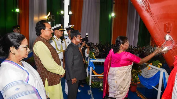 President Droupadi Murmu breaks a coconut during the launch ceremony of Vindhyagiri, the sixth ship of project 17A of Indian Navy, in Kolkata, Thursday