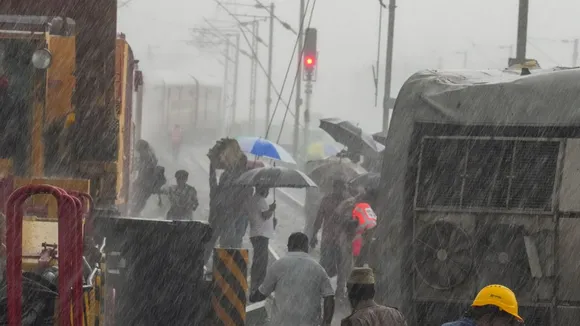 Restoration work underway after Mysuru-Darbhanga Bagmati Express train rammed into a stationary goods train on Friday, amid rain, at Kavaraipettai near Chennai, Saturday, Oct. 12, 2024