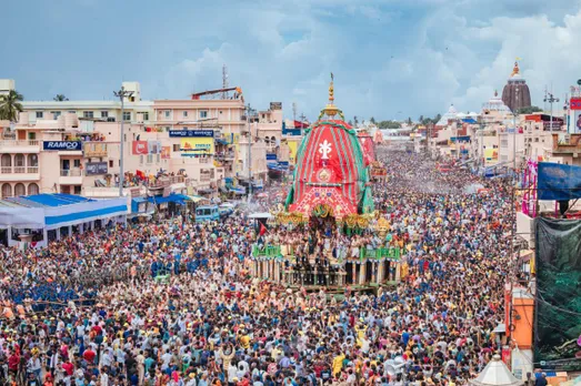 Devotees gather around the chariots of Lord Jagannath at Maushima temple in Puri, Monday, 8 July 2024.