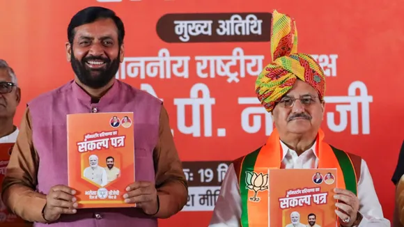 Union Minister and BJP National President JP Nadda with Haryana Chief Minister Nayab Singh Saini releases party's manifesto for the State Assembly elections, in Rohtak, Haryana, Thursday, Sept. 19, 2024.