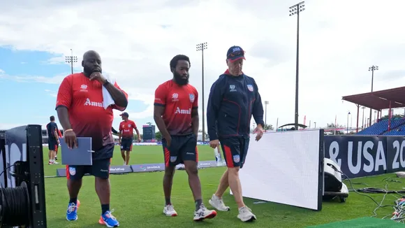 United States' Aaron Jones, centre, walks with team members before an ICC Men's T20 World Cup cricket match against Ireland at the Central Broward Regional Park Stadium in Lauderhill, Fla., Friday, June 14, 2024.