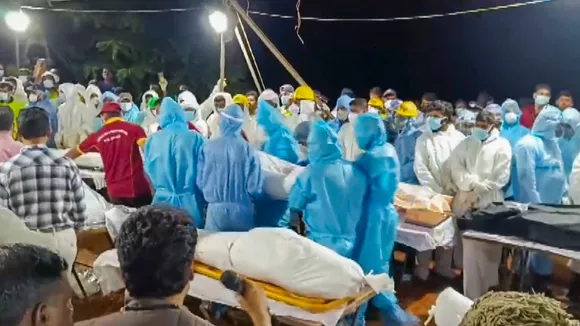 Mass cremation of the unidentified people who lost their lives in the recent landslides at the Pithumala burial ground, in Wayanad, Monday, Aug. 5, 2024