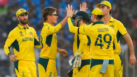 Australia's Adam Zampa with Josh Inglish celebrates the wicket of India's Jasprit Bumrah during the ICC Men’s Cricket World Cup 2023 final match between India and Australia, at the Narendra Modi Stadium, in Ahmedabad, Sunday, Nov. 19, 2023.