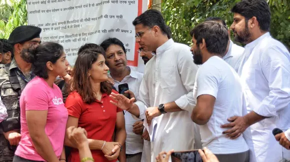 Congress leader Sachin Pilot with wrestlers Bajrang Punia, Vinesh Phogat and Sakshi Malik during the wrestlers' protest