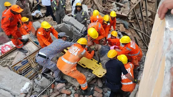 NDRF personnel carry out rescue work after two houses collapsed near the Kashi Vishwanath temple, in Varanasi, Tuesday, Aug. 6, 2024.