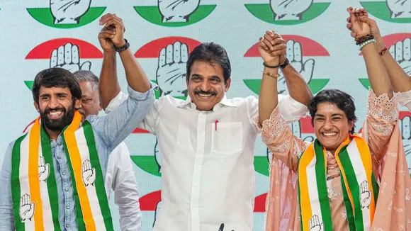 AICC General Secretary KC Venugopal with wrestlers Vinesh Phogat and Bajrang Punia as they joined Congress at the party headquarters, in New Delhi, Friday, Sept. 6, 2024.