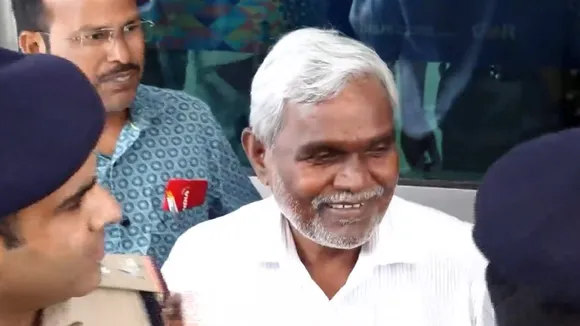 Former Jharkhand chief minister Champai Soren speaks with the media upon his arrival at Delhi airport, Sunday, Aug. 18, 2024.