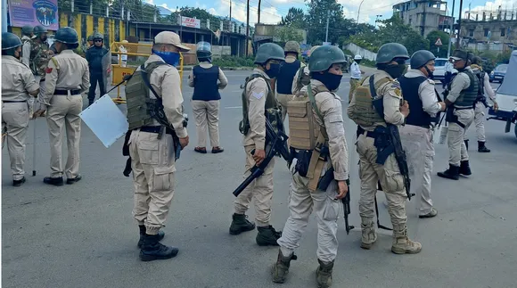 Security personnel stand guard at Moirangkhom in Imphal West district