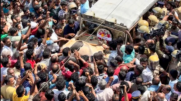 People block a forest officials’ vehicle during district-wide hartal at Pulpally, in Wayanad district, Saturday, Feb. 17, 2024. The wide hartal called by the ruling LDF, opposition UDF and BJP on Saturday to seek permanent solutions to the human-animal conflicts in the region was total but turned violent at Pulpally with protesters damaging a Forest department vehicle and tying a cow that was killed in a suspected tiger attack atop it earlier in the day.
