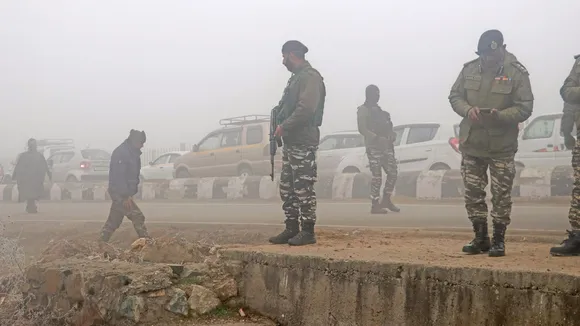 Security personnel at a search operation after detecting and defusing an IED put up by militants on Srinagar-Baramulla National Highway