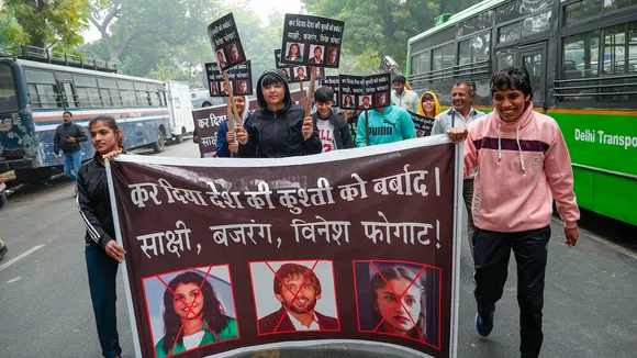  Young wrestlers hold placards during a protest against wrestlers Sakshi Malik, Bajrang Punia and Vinesh Phogat at Jantar Mantar, in New Delhi, Wednesday, Jan. 3, 2024.