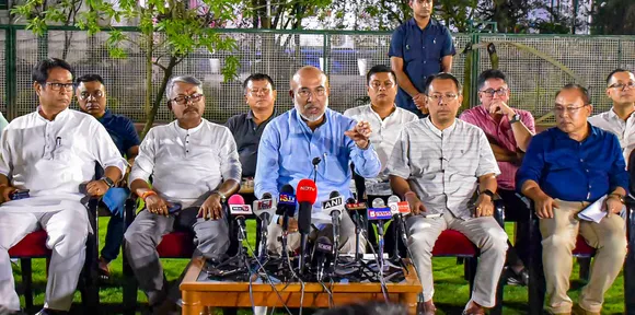 Manipur Chief Minister N Biren Singh with others addresses the media after holding a key security meeting, in Imphal