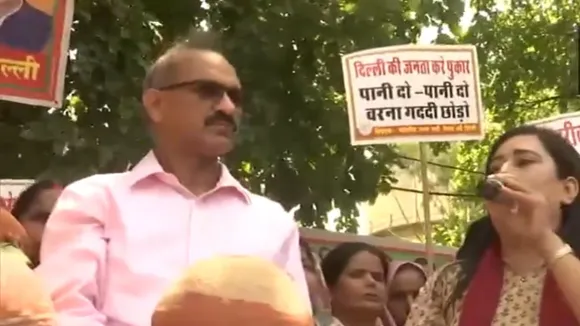 BJP MP from New Delhi Bansuri Swaraj takes part in 'matka-phod' protest against Delhi government over the water shortage in Delhi.