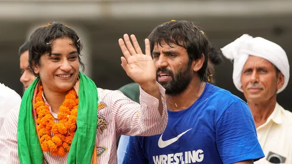Wrestler Vinesh Phogat with Bajrang Punia being welcomed on her arrival after Paris Olympics heartbreak, at IGI airport, in New Delhi, Saturday, Aug. 17, 2024.