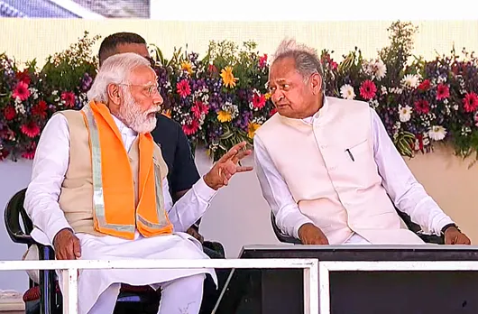 Prime Minister Narendra Modi with Rajasthan Chief Minister Ashok Gehlot during a programme to lay foundation stone and dedicate various projects, in Nathdwara
