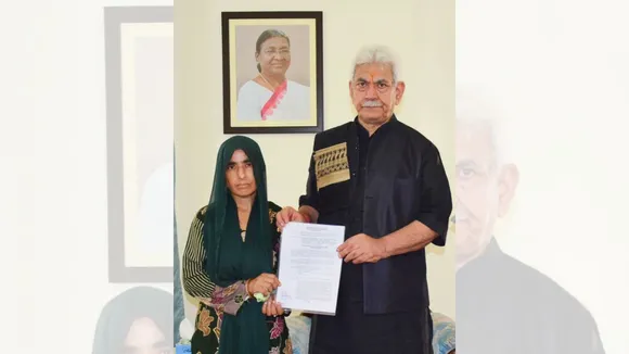 J&K LG Manoj Sinha handed over the appointment letter to the wife of a bus driver who was among nine persons killed in a terror attack on Saturday