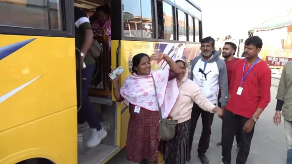 Devotees board a bus as they leave for the Amarnath Yatra from Pathna Chowk base camp, in Srinagar, Saturday, July 13, 2024.