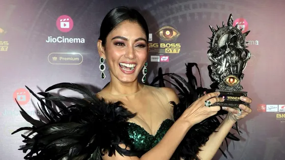 Big Boss OTT Season 3 winner Sana Makbul poses with the trophy after the reality show's grand finale, in Mumbai