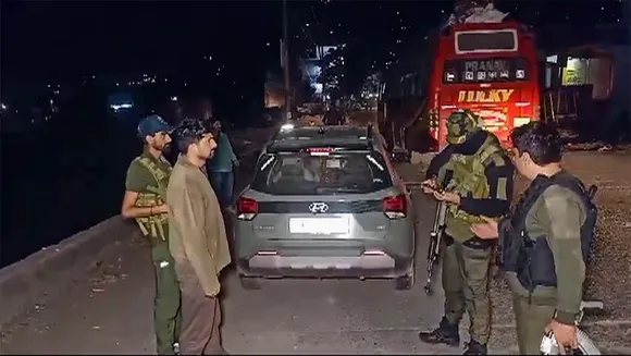 Security personnel stand guard after a terrorist attack on army vehicles, in Poonch district, Saturday, May 4, 2024.