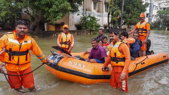 NDRF personnel evacuate residents from a waterlogged area after heavy rainfall owing to Cyclone Michaung, in Kanchipuram, Tuesday, Dec. 5, 2023