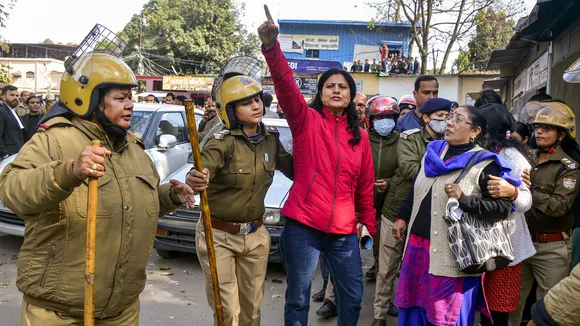 A protestor raises slogans at Shaheed Smarak in district court premises against police action during Thursday's protest over alleged irregularities in state government recruitment examinations in Dehradun on Friday