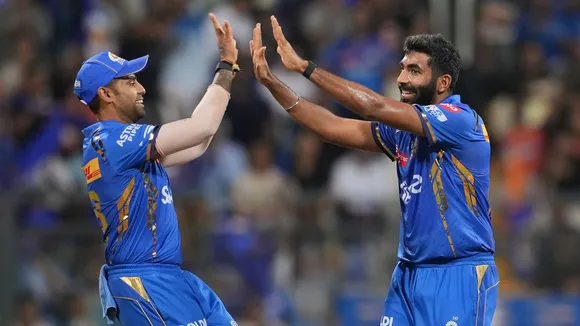 Mumbai Indians bowler Jasprit Bumrah with Suryakumar Yadav celebrates the wicket of Sunrisers Hydrabad batter Abhishek Sharma during the Indian Premier League (IPL) 2024 T20 cricket match