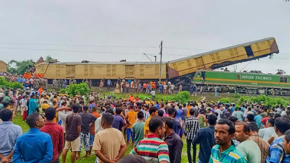 Locals gather after a collision between the Kanchanjungha Express and a goods train, near Rangapani railway station, on Monday, June 17, 2024.