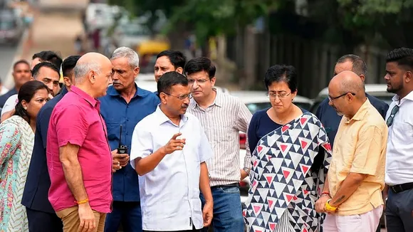 Delhi Chief Minister Atishi with former chief minister Arvind Kejriwal and former deputy chief minister Manish Sisodia inspects roadwork in the Delhi University area, in New Delhi, Thursday, Sept. 26, 2024.
