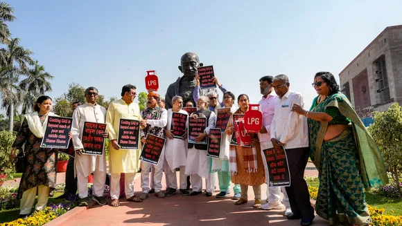 TMC MPs stage a protest near the statue of Mahatma Gandhi against hike in price of LPG cylinder during the Budget Session of Parliament