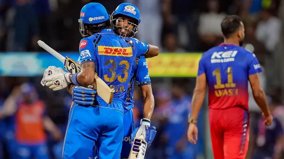 Mumbai Indians captain Hardik Pandya and Tilak Verma celebrate their win after the IPL 2024 cricket match against Royal Challengers Bengaluru and Mumbai Indians at Wankhede Stadium, in Mumbai, Thursday, April 11, 2024.